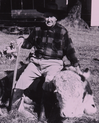 M.A. Fortune sitting on his bull